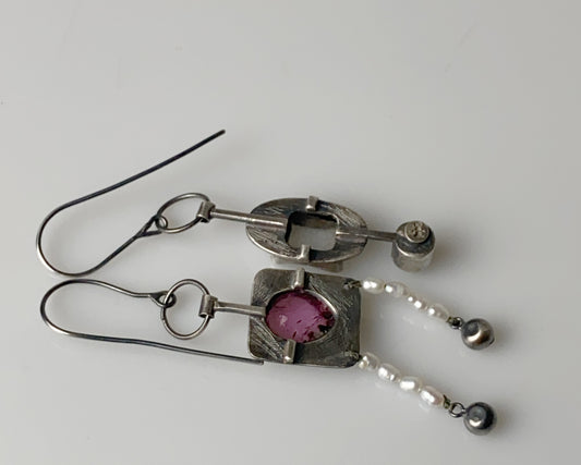 Handcrafted dangle earrings featuring rose tourmaline, quartz, jade and pearl accents.