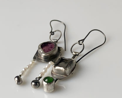 Handcrafted dangle earrings featuring rose tourmaline, quartz, jade and pearl accents.