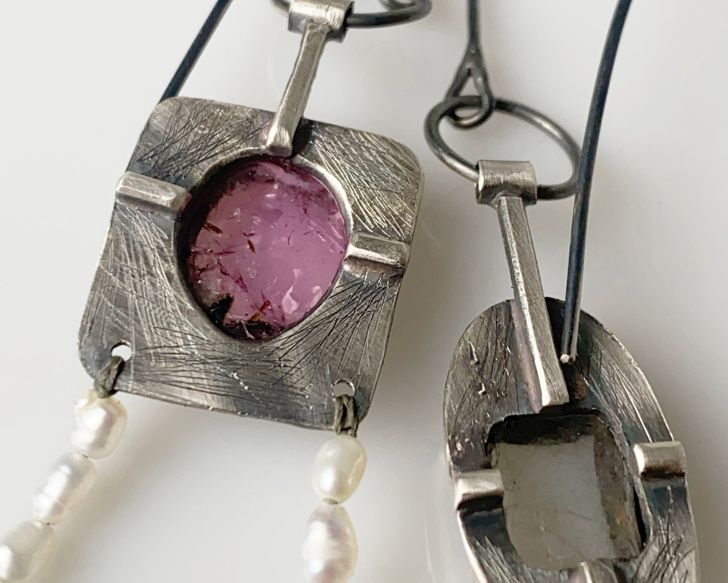 Handcrafted dangle earrings featuring rose tourmaline, quartz, jade and pearl accents.