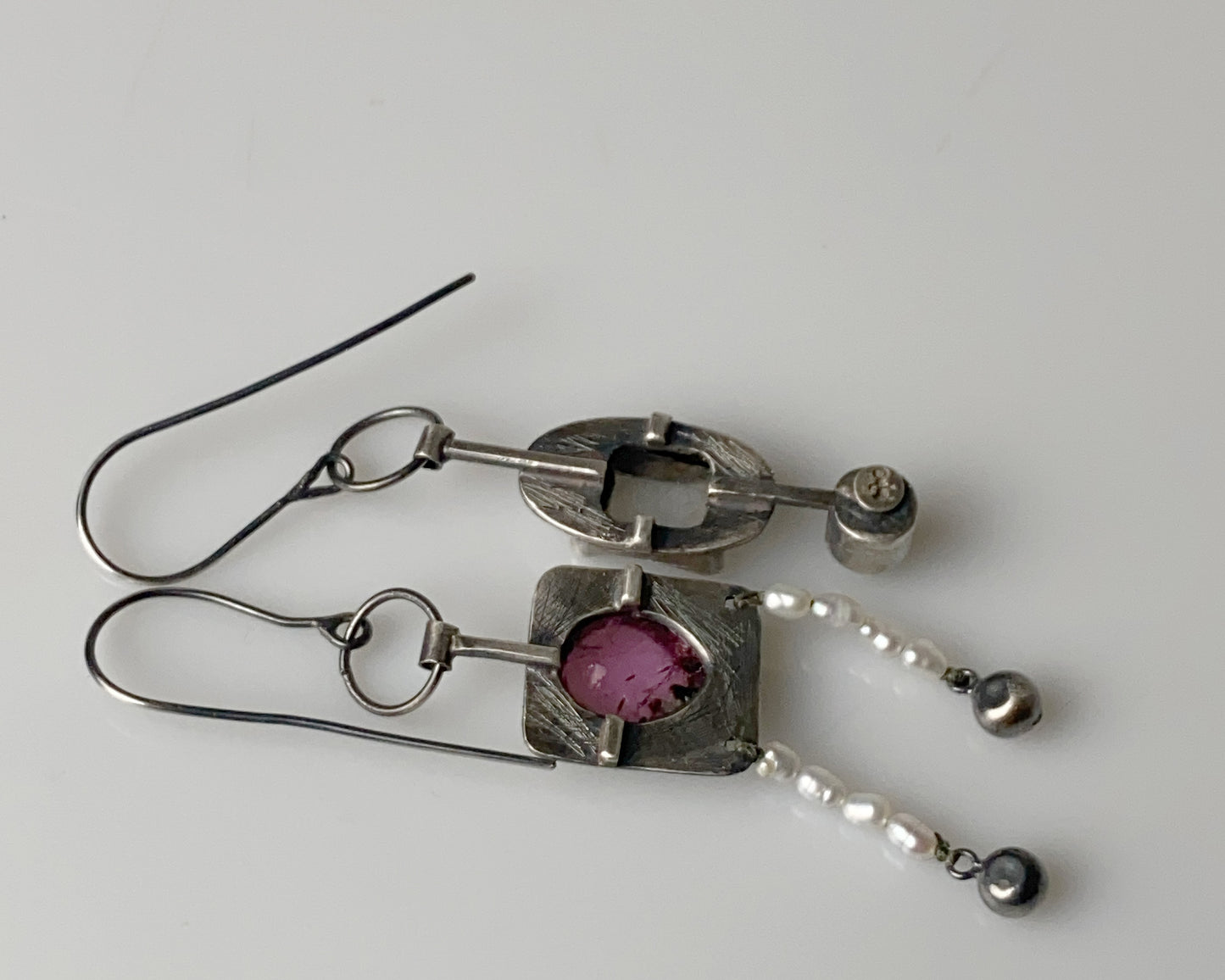 Handcrafted dangle earrings featuring rose tourmaline, quartz, jade and pearl accents.