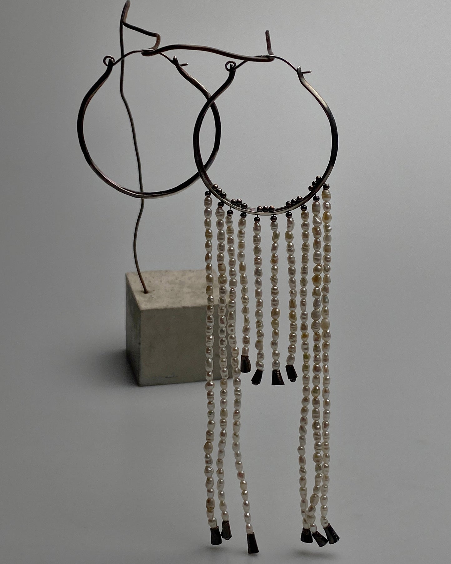 Earrings with pearl pendants