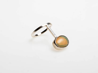 Minimalistic ring with oval-shaped natural Brazilian opal