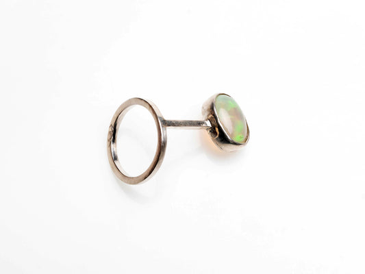 Minimalistic ring with oval-shaped natural Brazilian opal